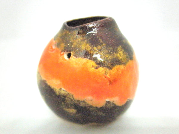 Miniature ceramic with golden brown and orange glaze