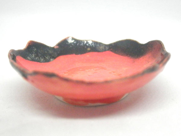 Miniature ceramic red bowl with black rim