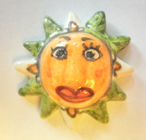 Miniature ceramic Mexican Sun sculpture with lilies