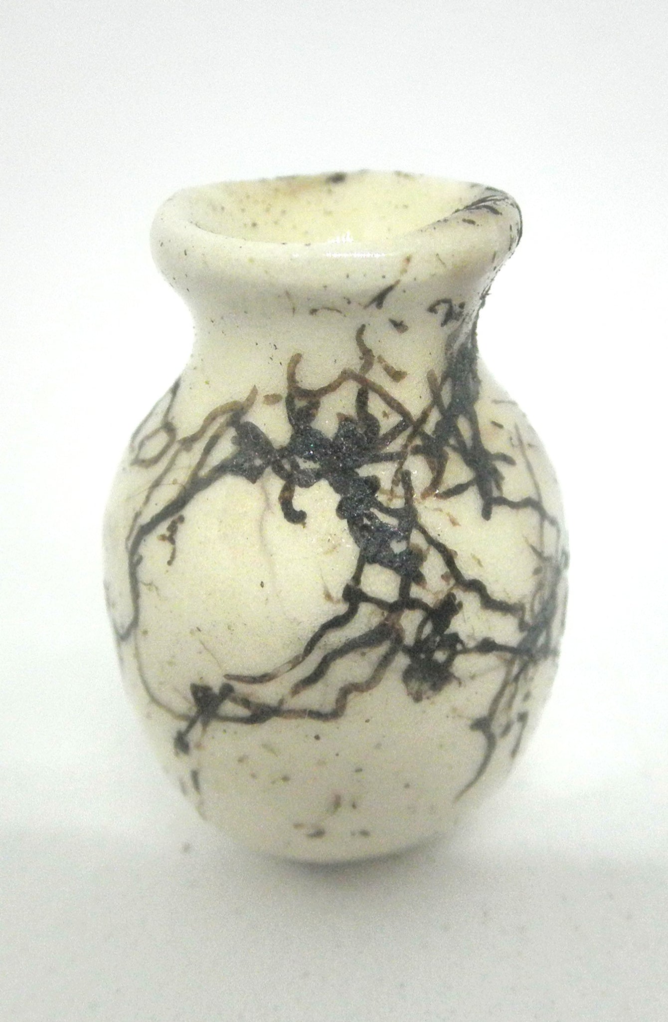 Miniature ceramic vase with hair decoration. #B