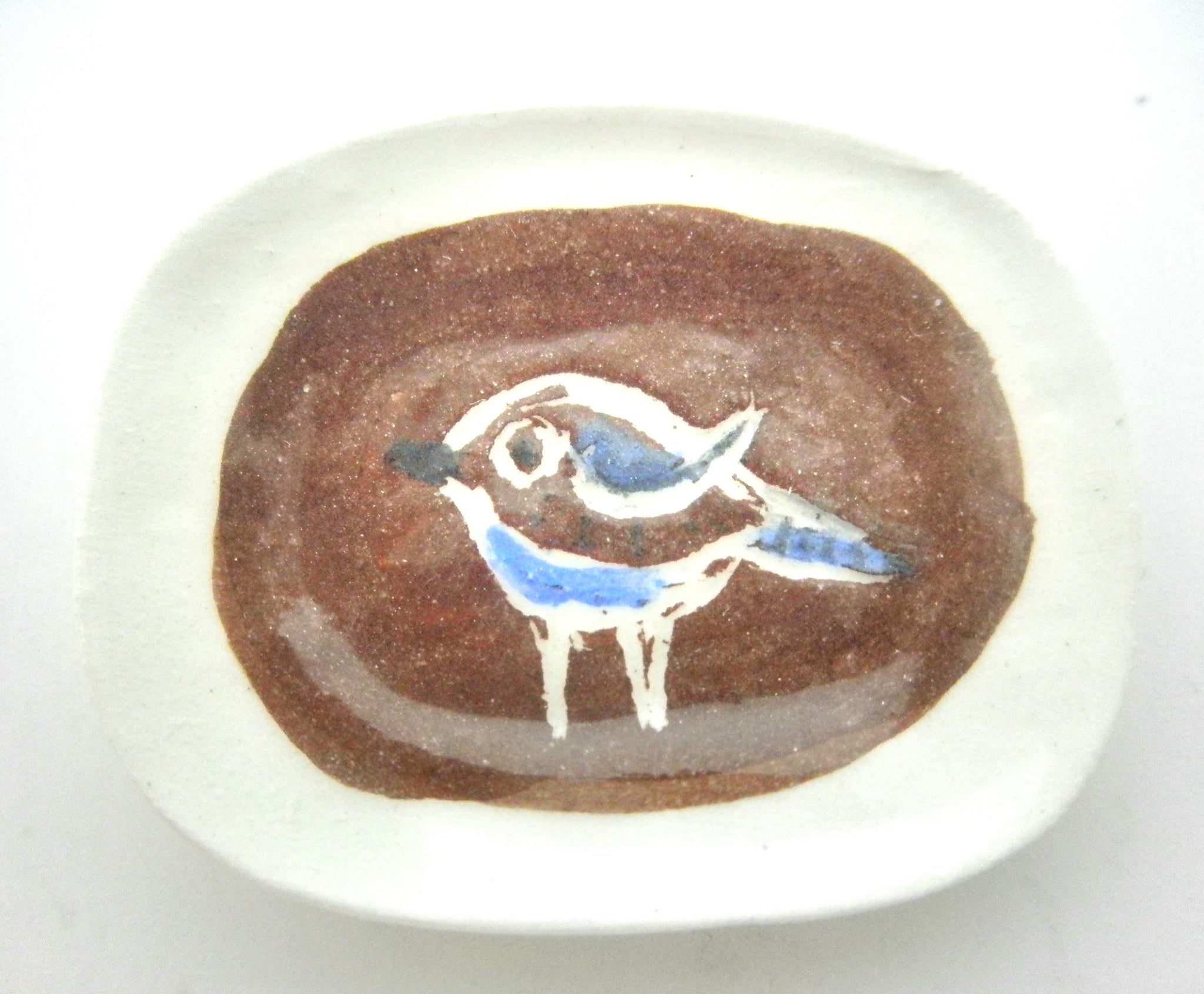 Miniature Picasso inspired ceramic plate -  bird on brown background