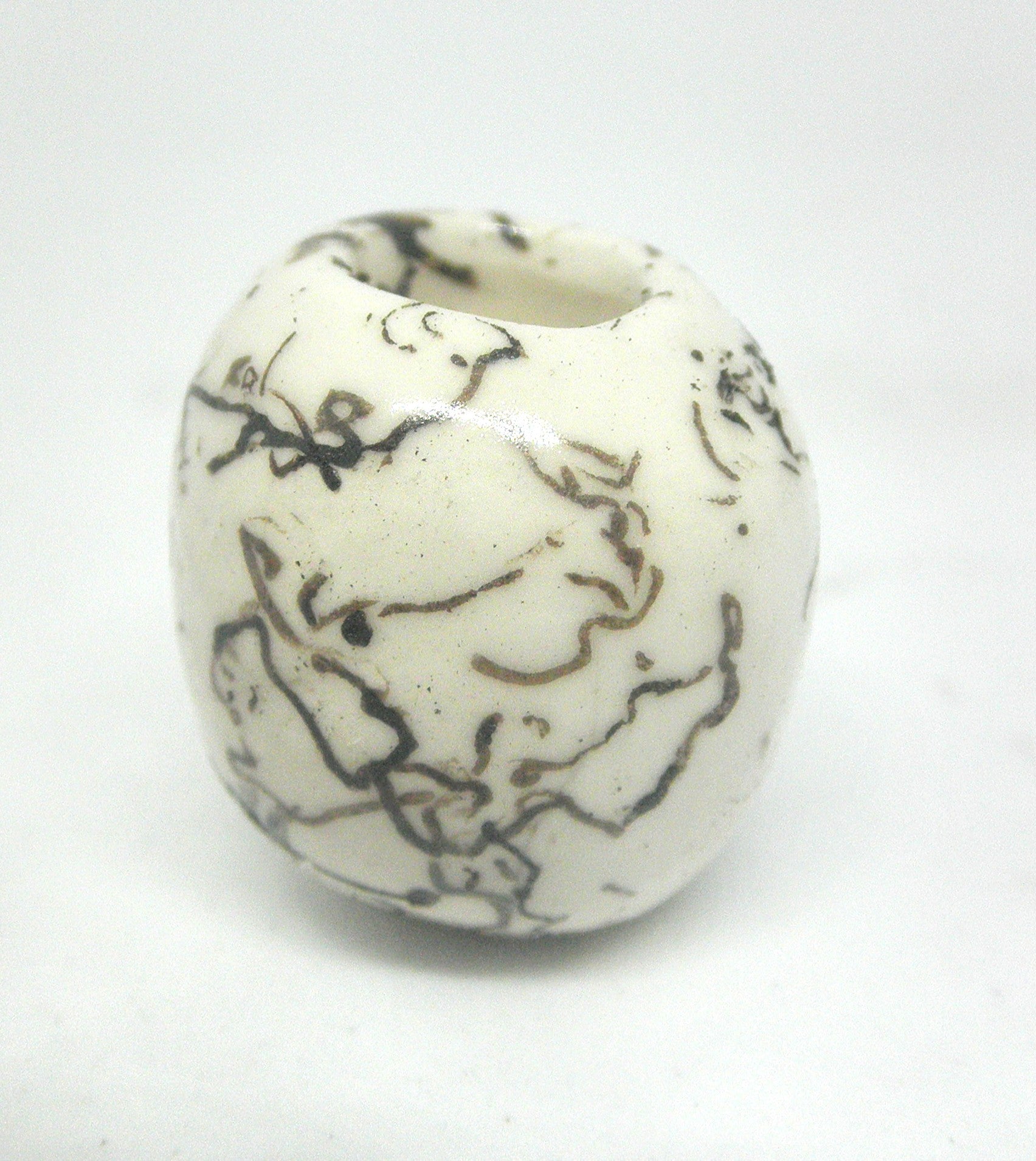 Miniature ceramic small vase with hair decoration.