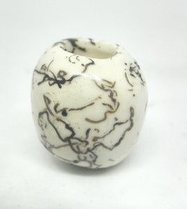 Miniature ceramic small vase with hair decoration.