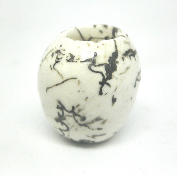 Miniature ceramic small vase with hair decoration.