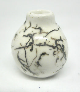 Miniature ceramic small vase with hair decoration.