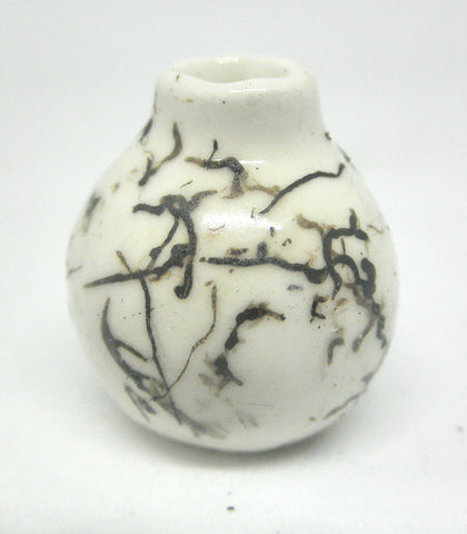 Miniature ceramic small vase with hair decoration.