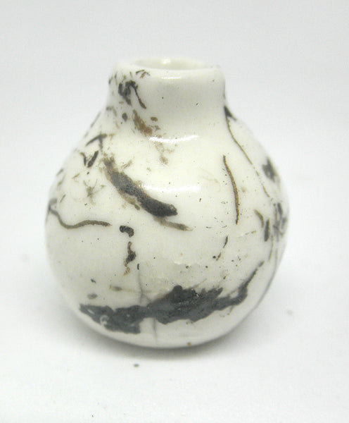 Miniature ceramic small vase with hair decoration.