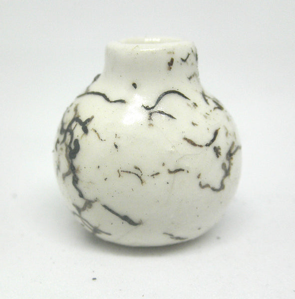 Miniature ceramic small vase with hair decoration.