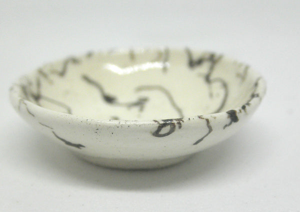 Miniature ceramic bowl with hair decoration. #E