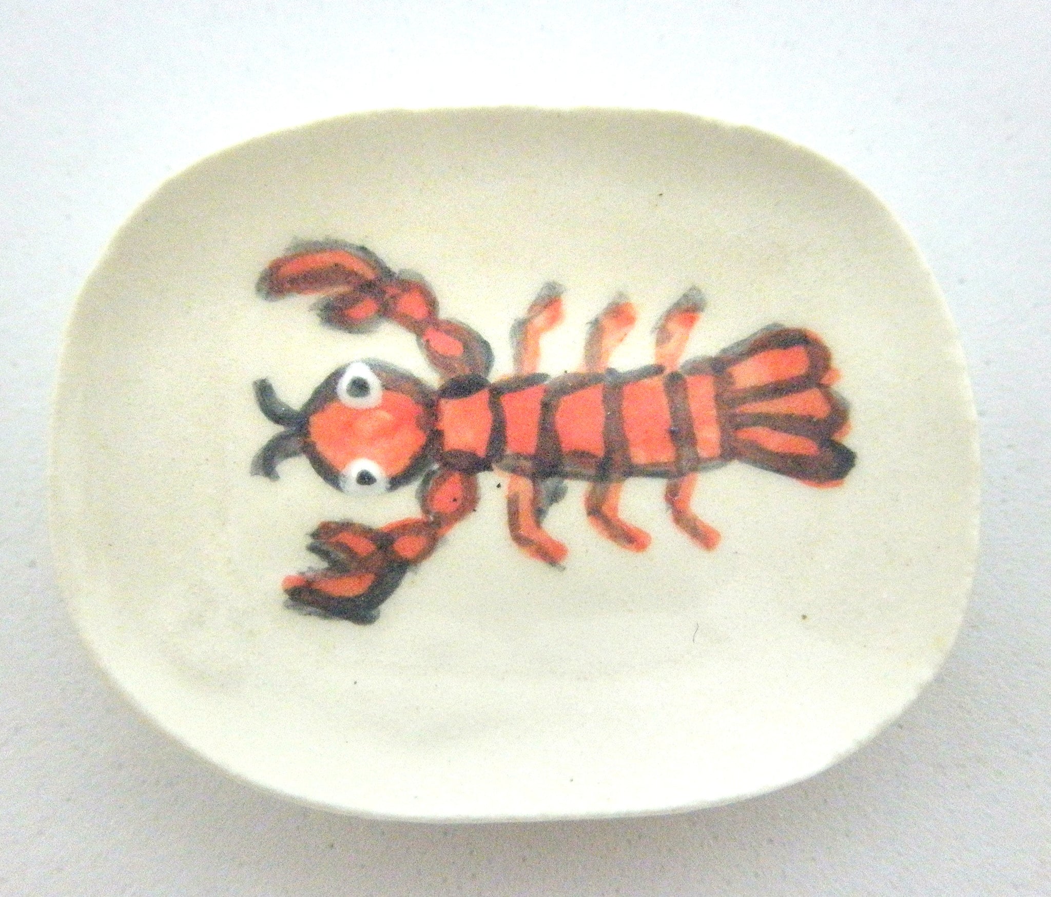 Miniature ceramic dish with red lobster