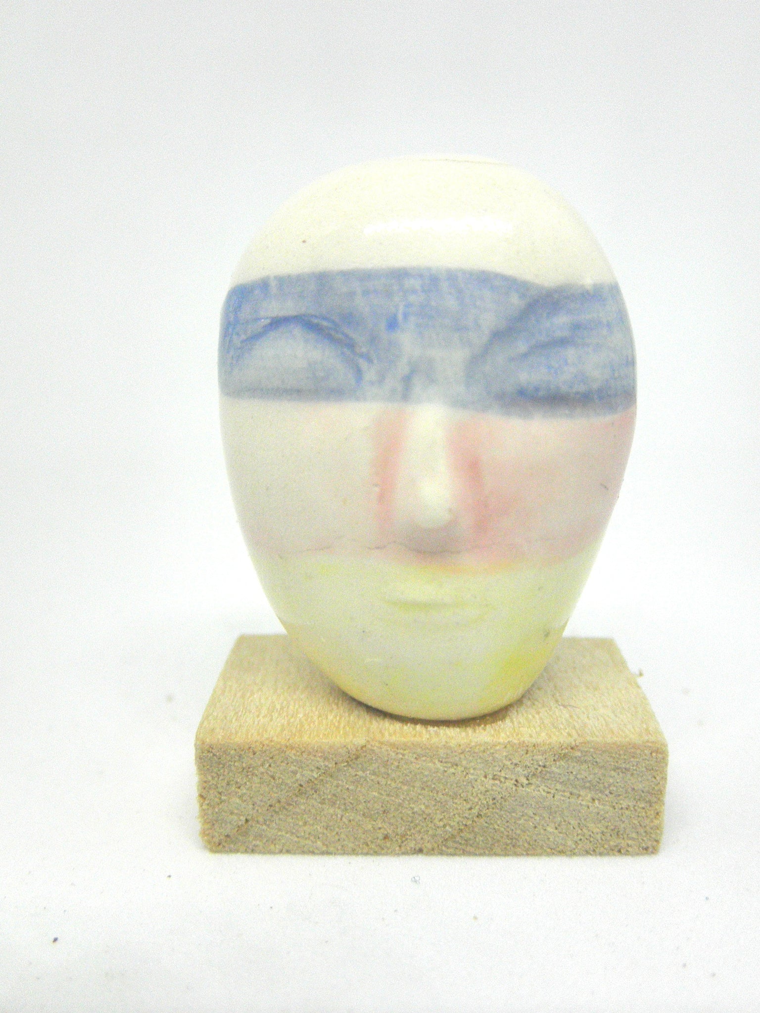 Miniature ceramic collector's head with pastels
