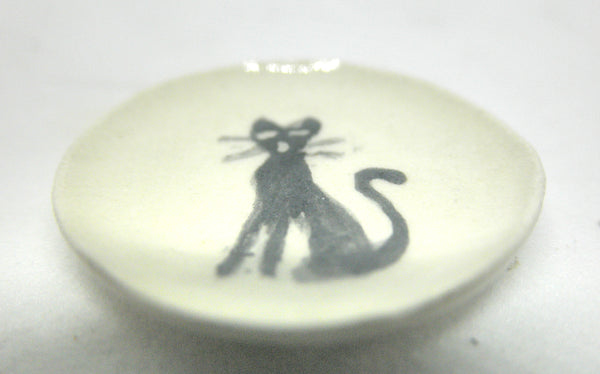 Miniature ceramic plate with sitting black cat