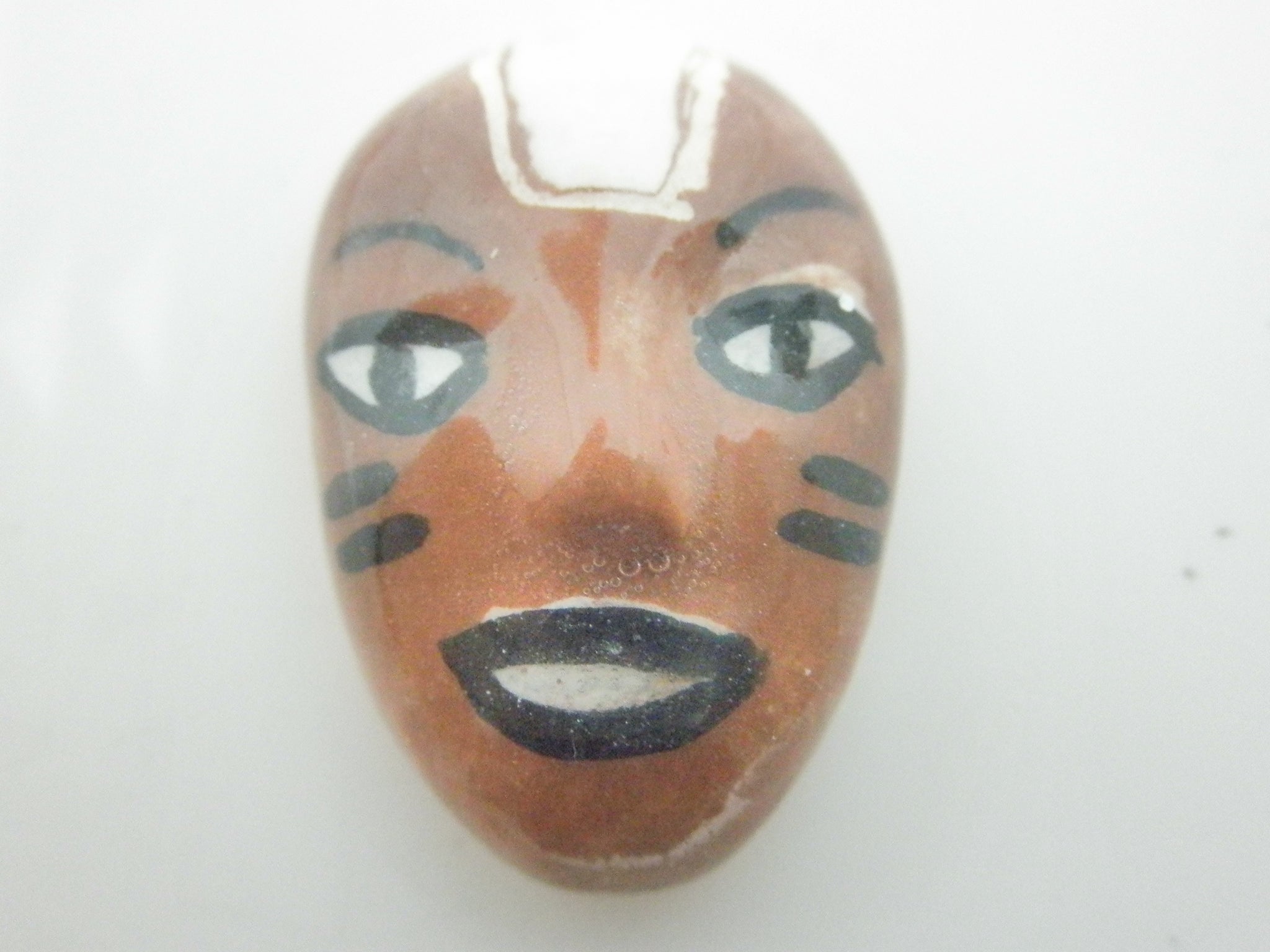 Miniature African art mask brown and white