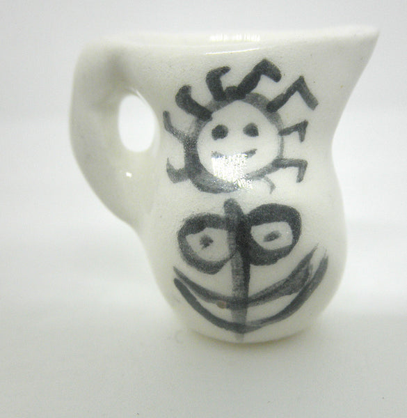 Miniature Picasso inspired pitcher - stylized woman on white.