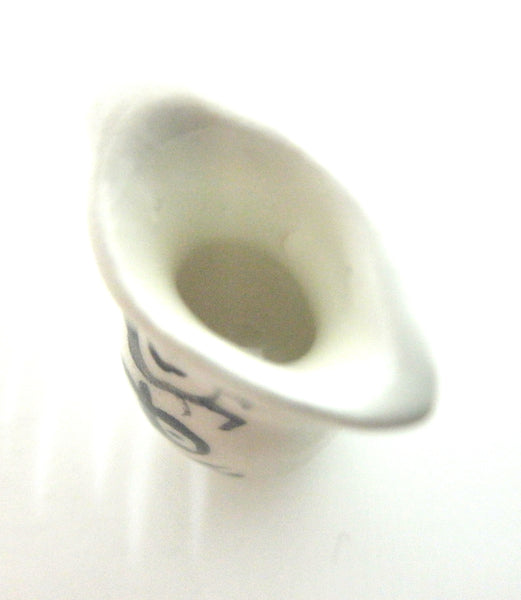 Miniature Picasso inspired pitcher - stylized woman on white.