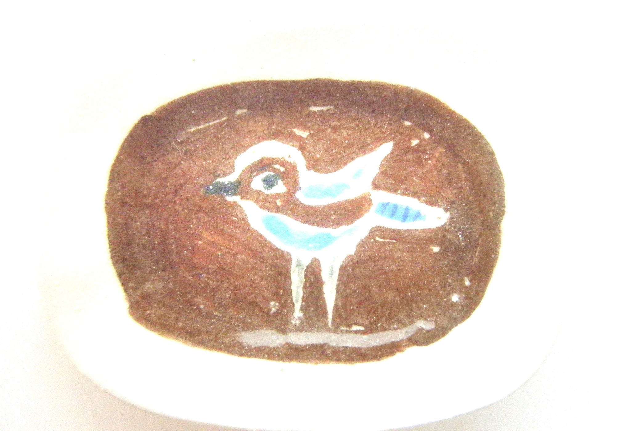 Miniature Picasso inspired ceramic plate -  bird on brown background