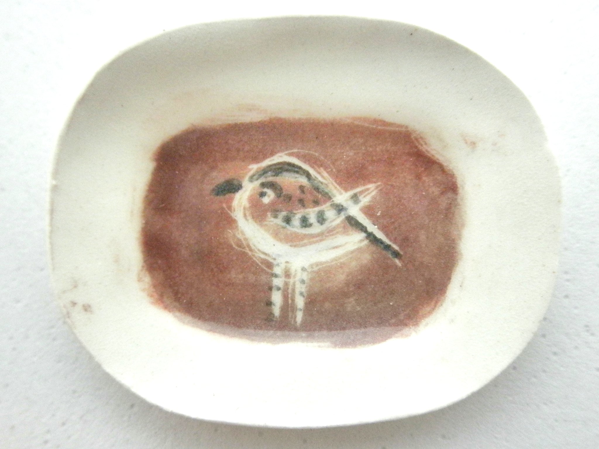 Miniature Picasso inspired ceramic plate -  bird on brown background