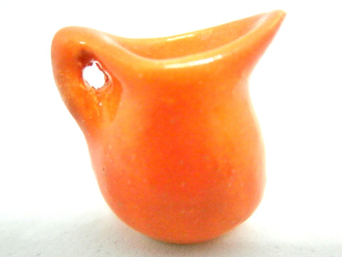 Miniature ceramic pitcher fiesta ware orange.