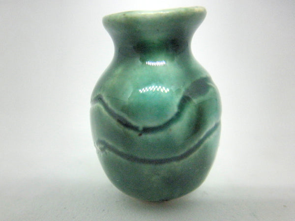 Miniature ceramic vase - round carved green