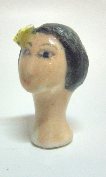 Miniature collector's figurine woman with butterfly