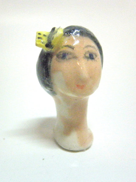 Miniature collector's figurine woman with butterfly