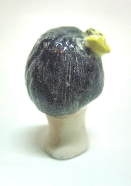 Miniature collector's figurine woman with butterfly