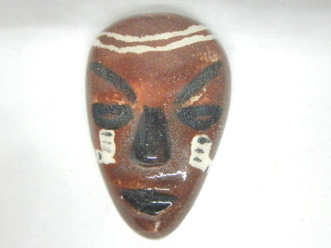 Miniature African art mask black brown and white