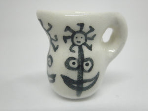 Miniature Picasso inspired pitcher - stylized woman on white.