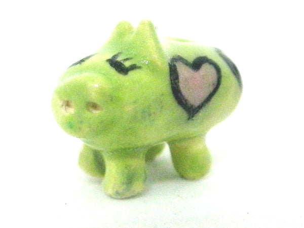 Miniature ceramic piggy bank - green with pink hearts