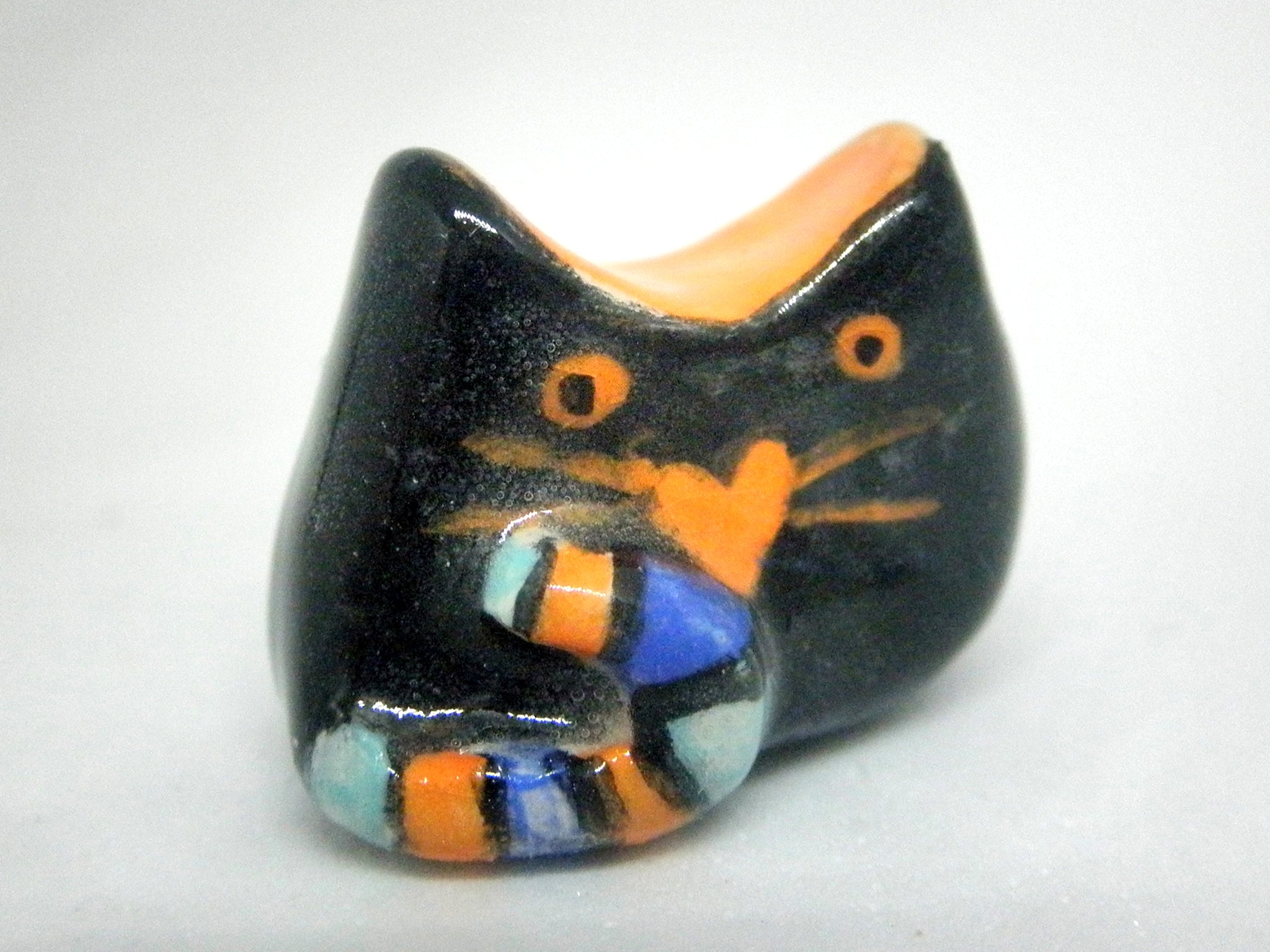 Miniature whimsical ceramic cat sculpture - black and orange