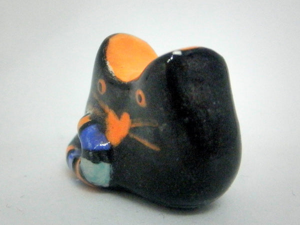 Miniature whimsical ceramic cat sculpture - black and orange