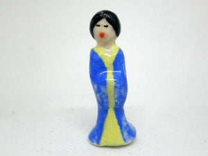 Miniature figurine of Japanese Lady in blue and yellow kimono