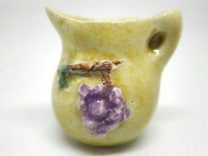 Miniature Italian pitcher with grapes