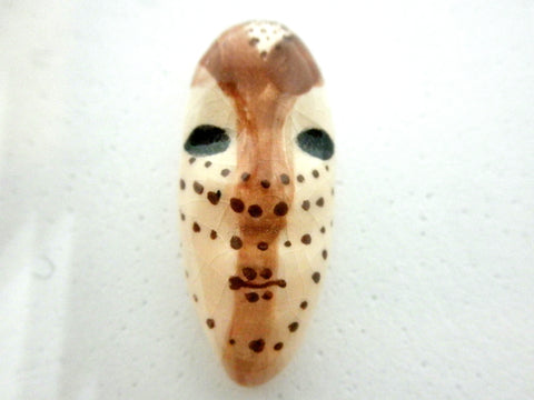 Miniature African art mask elongated beige
