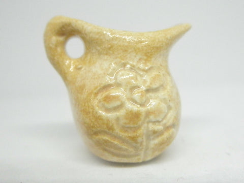 Miniature pitcher carved, sand beige