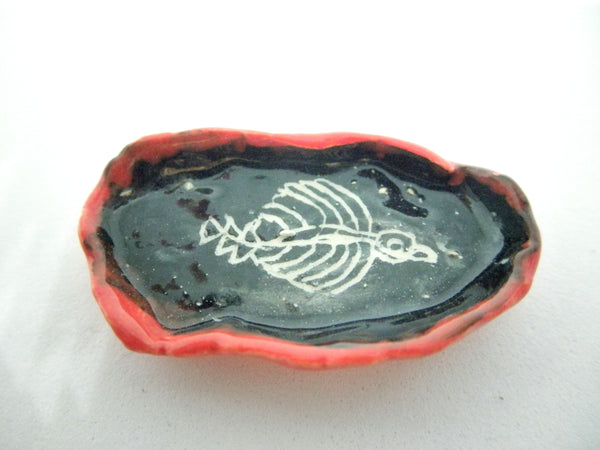 Ceramic Halloween dish with bird skeleton
